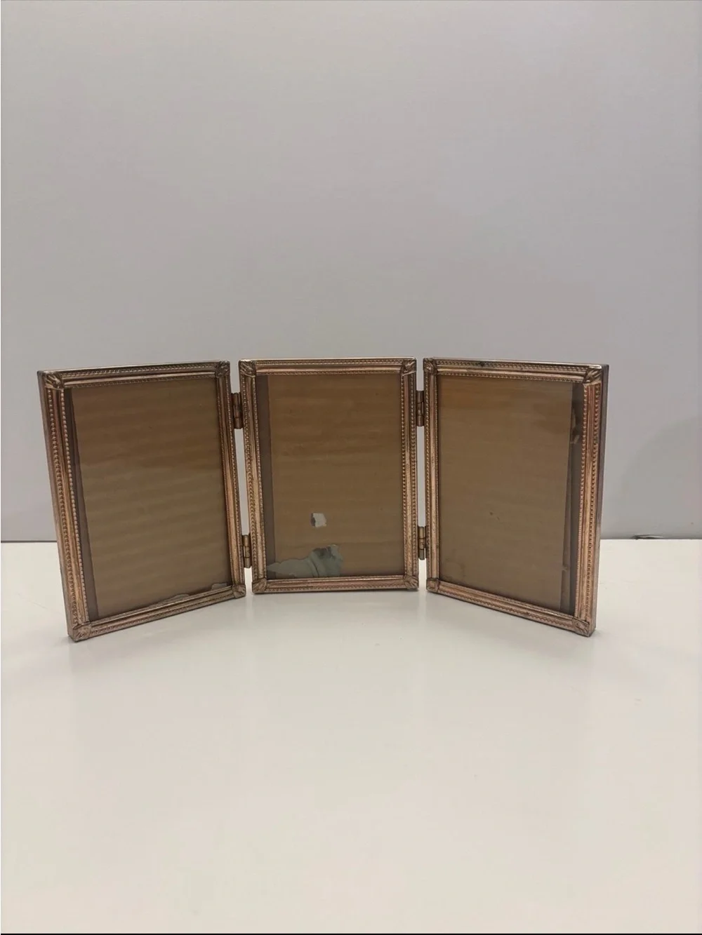 Vintage ornate golden color tri fold picture frame